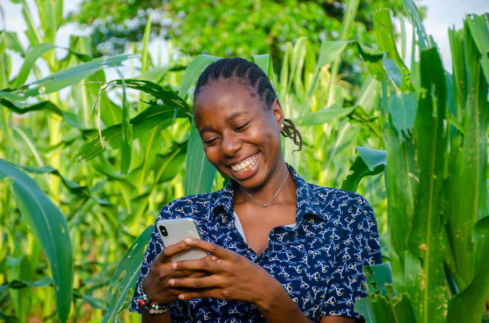 female african farmer using her phone